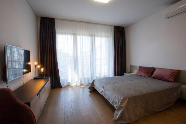 istock Interior of a bedroom with large master bed 1389648423