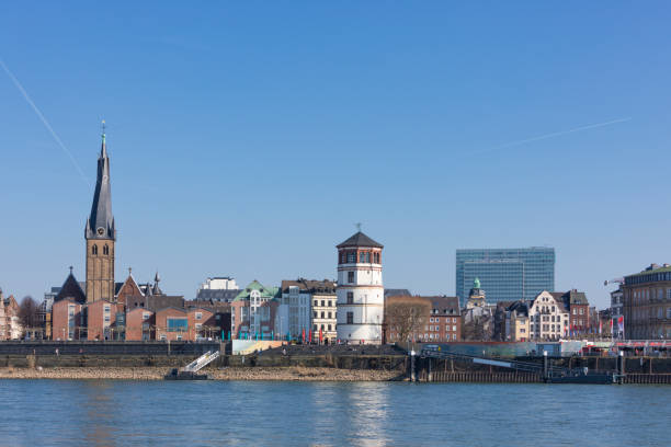 Burgplatz square at Dusseldorf with Lambertuskirche church and Schlossturm tower, Dreischeibenhaus building in background
