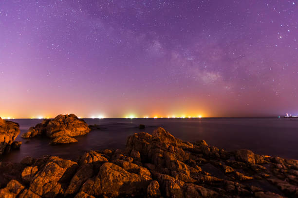 istock sea at night and beautiful Milky Way 1389649625