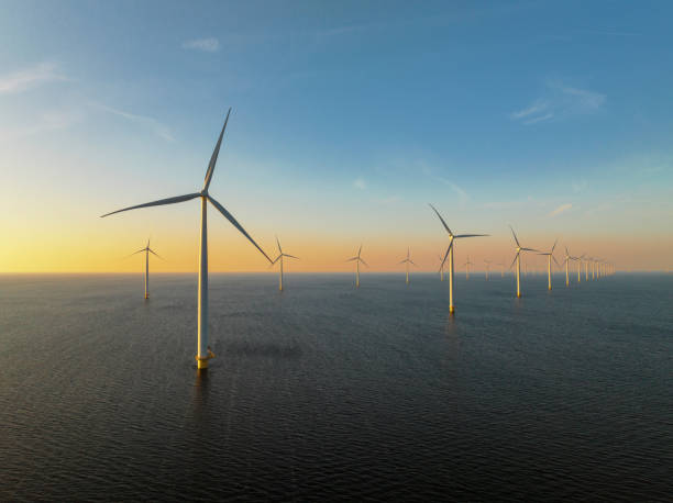 istock Wind turbines in an offshore wind park producing electricity 1389649714