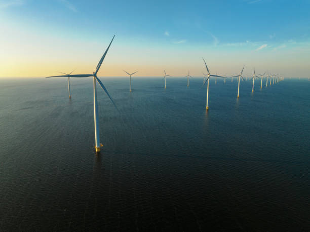 istock Wind turbines in an offshore wind park producing electricity 1389649854