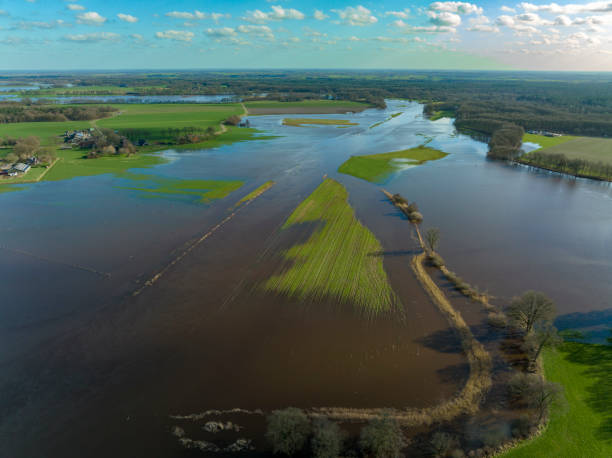 istock Vecht river high water level flooding at the Junne weir drone view 1389649995