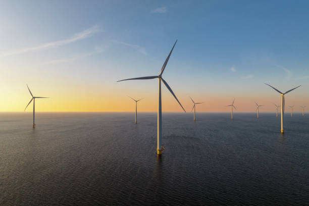 istock Wind turbines in an offshore wind park producing electricity 1389650192