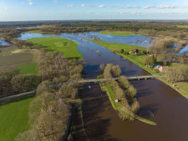 istock Vecht river high water level flooding at the Junne weir drone view 1389650239