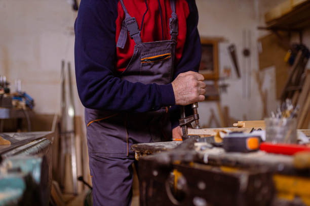 istock Carpenter with pen marks the design on the timber 1389652005