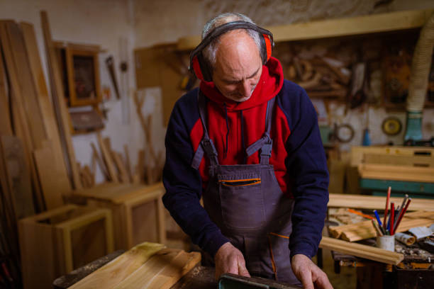 istock Carpenter cutting wooden 1389652116