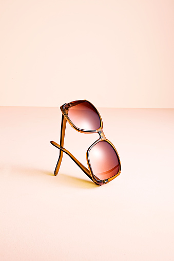 Fashionable sunglasses isolated on pink background (with clipping path)