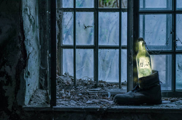 istock luminous bottle in a old shoe 1389653622
