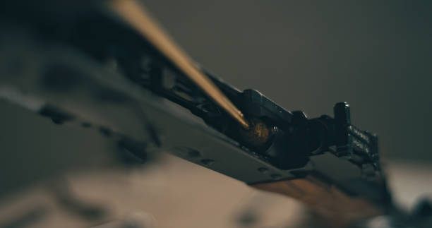 istock Man cleaning the AK-47 gun, disassembling and preparing to use. Close up on hands 1389654922
