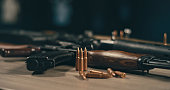 Machine gun and bullets on a table. Ready to shot