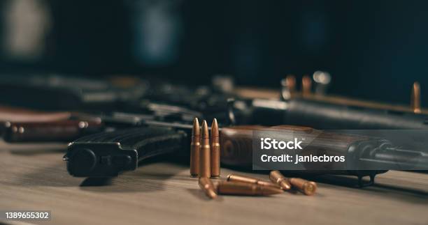 Machine Gun And Bullets On A Table Ready To Shot Stock Photo - Download Image Now - Gun, Weapon, Bullet