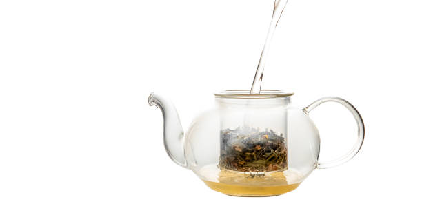 istock herbal tea served in a transparent glass teapot isolated over white backgound ready for breakfast or tea ceremony 1389656000