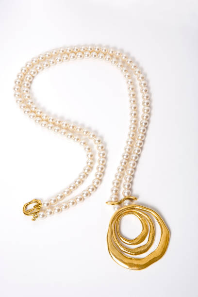 istock Pearl necklace on white background 1389656061