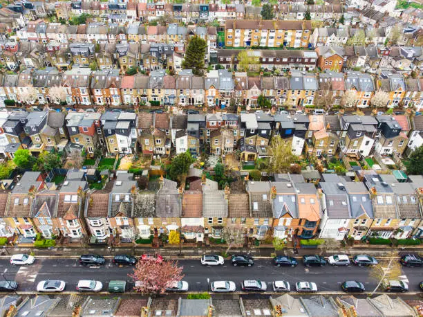 Aerial view, taken by drone, depicting the row houses and residential streets of Walthamstow in east London, UK.