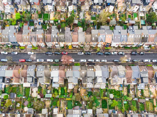 Aerial view, taken by drone, depicting the row houses and residential streets of Walthamstow in east London, UK.