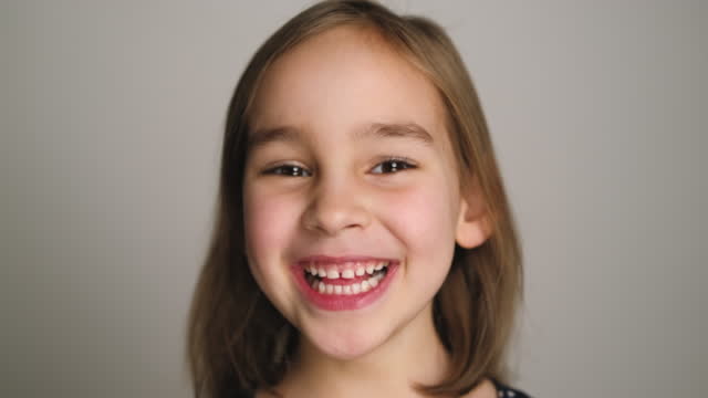 Portrait Shot Of A Beautiful Preschool Child Girl Smiling