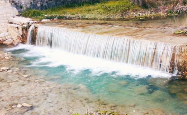 istock Small waterfall with beautiful nature colors . 1389658836