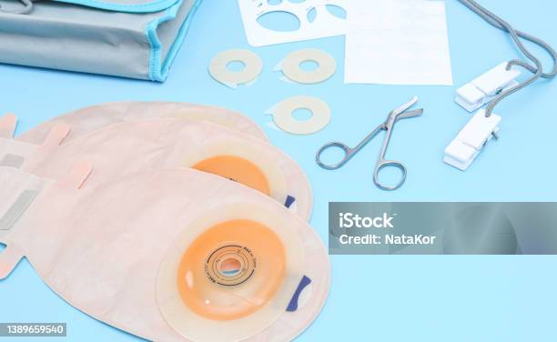 Set Of Colostomy Bag On A Blue Background Stock Photo - Download Image Now - Bag, Colostomy, Stoma - Anatomy