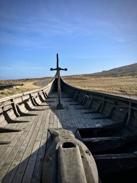 Viking Longship, Unst, Shetland March 19th, 2022, Haroldswick, Unst, Shetland Islands, UK.  The Shetland Islands are particularly beautiful and their culture owes much to a Scandinavian past dating back over a thousand years.

The islanders are very proud of their past and local islanders have made a wonderful reproduction of a Viking longship, which lies displayed adjacent the open road, so that tourists can just park up and admire their splendid work.  This is the type of vessel that the island's Scandinavian settlers would have arrived in.   

The islanders Viking heritage  is celebrated annually when they hold their famous.'Up Helly Aa' festival between January and March, during which they dress up in spectacular Viking costumes and brandish blazing torches, as they march through the streets of Lerwick, where the biggest parade of the festival is held. mcdermp stock pictures, royalty-free photos & images