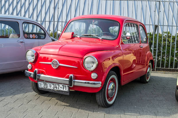 Rome, Italy - March 2, 2014: front closeup of a grey Fiat 1100 BL assembled in 1948 during the Sunday Meeting of vintage cars in Rome, close to Piramide Cestia.