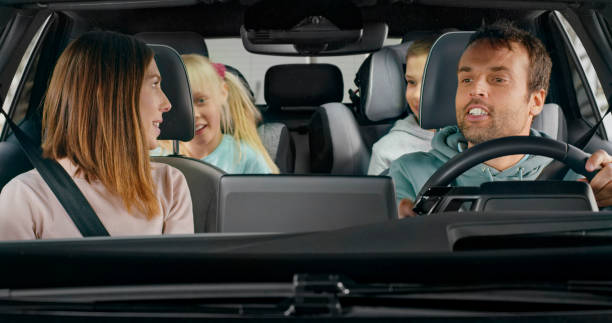 istock Family sitting in modern car 1389670272