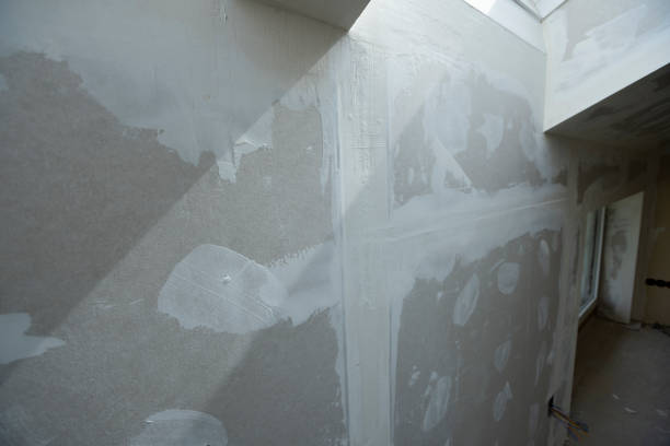 istock Attic finishing in the phase drywall spackling and plastering 1389672158