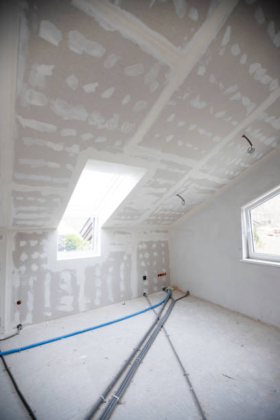 istock Attic finishing in the phase drywall spackling and plastering 1389674600