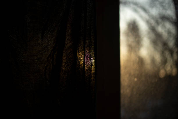 istock Curtain on window in morning. Dawn outside window. 1389674669