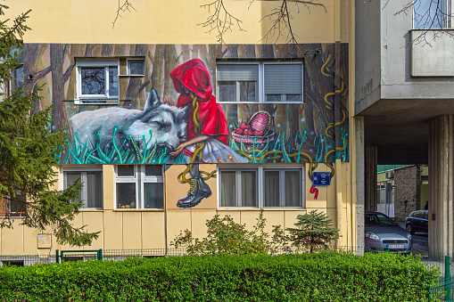 Belgrade, Serbia - April 01, 2022: Fairy Tale Little Red Riding Hood House Mural at Brothers Grimm Street.