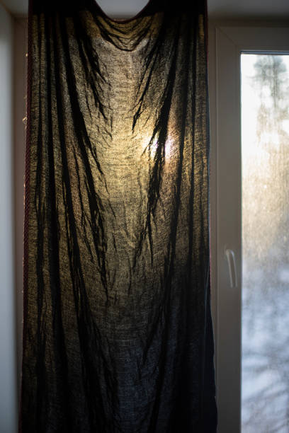 istock Curtain on window in morning. Dawn outside window. 1389674692