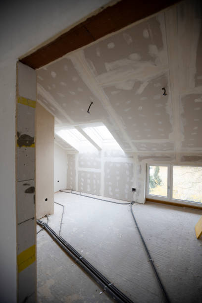 istock Attic finishing in the phase drywall spackling and plastering 1389676356