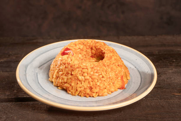 Traditional turkish bulgur pilaf with tomato sauce in plate