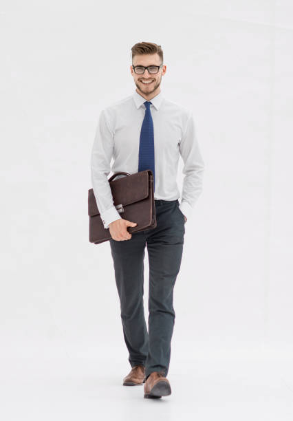 istock businessman in a white shirt steps forward 1389678243