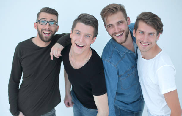 istock top view..a group of happy young men looking at the camera 1389678499