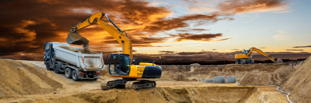 excavator is working on construction site stock photo