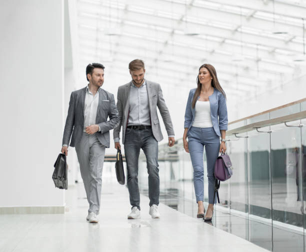 istock business team goes and discusses business issues 1389678704