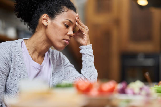 istock Young black woman feeling worried in the kitchen. 1389679294