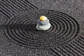 istock Japanese zen garden with stone and sand 1389679326