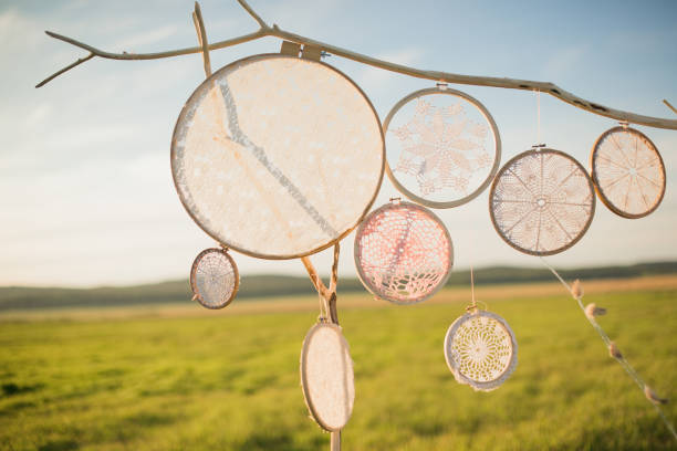 istock Openwork dream catchers hang on a wooden arch, in nature. 1389679599