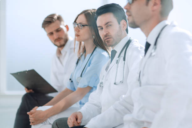 istock Doctors listen during an office meeting 1389679602