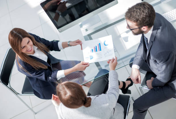 istock top view.business team discussing new financial project 1389679981