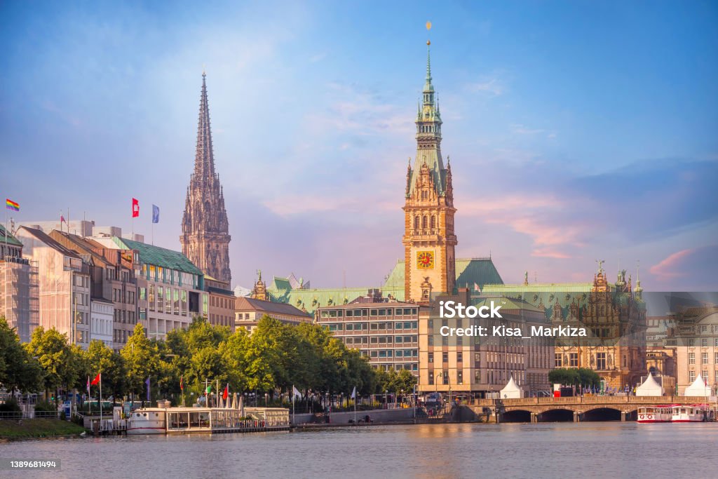 Hamburg Rathaus and Alster lake, Germany Hamburg, Germany colorful pink sunset or sunrise view of city center with Rathaus town hall and Alster lake Hamburg - Germany Stock Photo