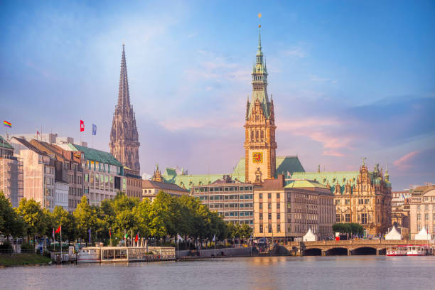 Hamburg Rathaus and Alster lake, Germany Hamburg, Germany colorful pink sunset or sunrise view of city center with Rathaus town hall and Alster lake hamburg stock pictures, royalty-free photos & images