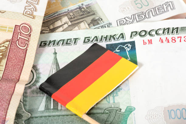 istock Flag of Germany and ruble banknotes 1389681856
