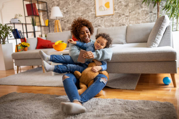 istock Funny mother and son playing together 1389683581