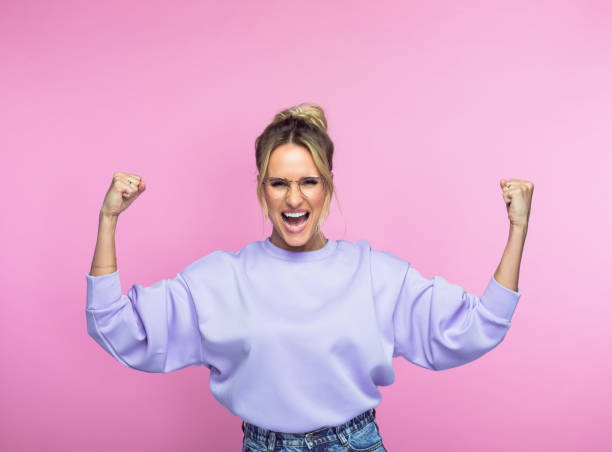 istock Happy successful woman clenching fists 1389683587