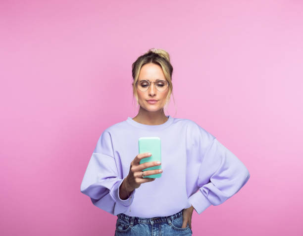 istock Woman taking selfie with mobile phone 1389684663