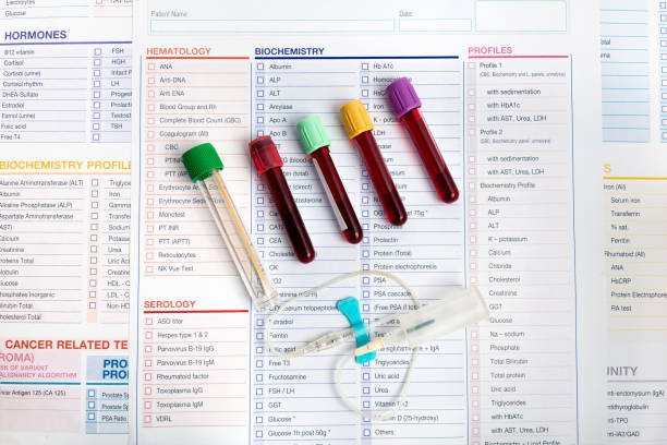 Workplace of laboratory with Blood tubes samples and requisition form for analysis in the Biochemistry laboratory stock photo