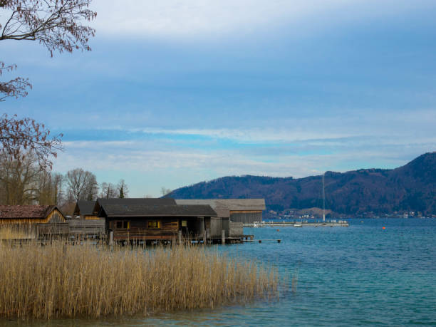 Attersee in the Salzkammergut in Austria. Beautiful natural beach with reeds and stilt huts. Upper Austria, Europe.