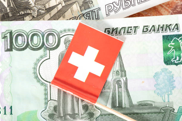 istock Flag of Switzerland and ruble banknotes 1389687608